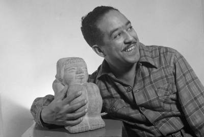 Langston Hughes with sculpture from https://en.m.wikipedia.org/wiki/File:Langston_Hughes.jpg