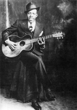 Robert Johnson - Fair Use" from https://en.wikipedia.org/wiki/File:Robert_Johnson.png